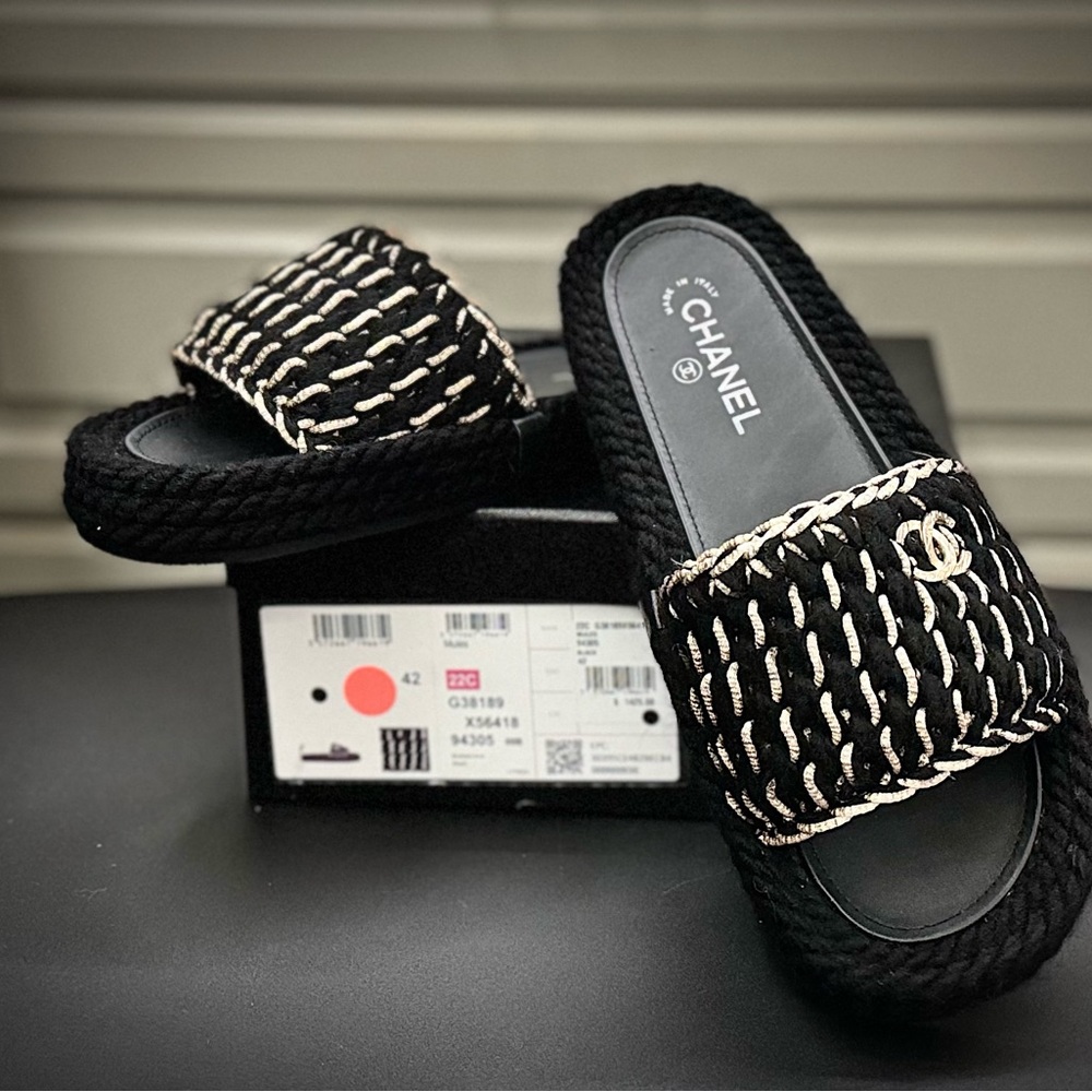 New CHANEL Braided Knit Black Mules. Size 42 with gold CC adornments. 22C